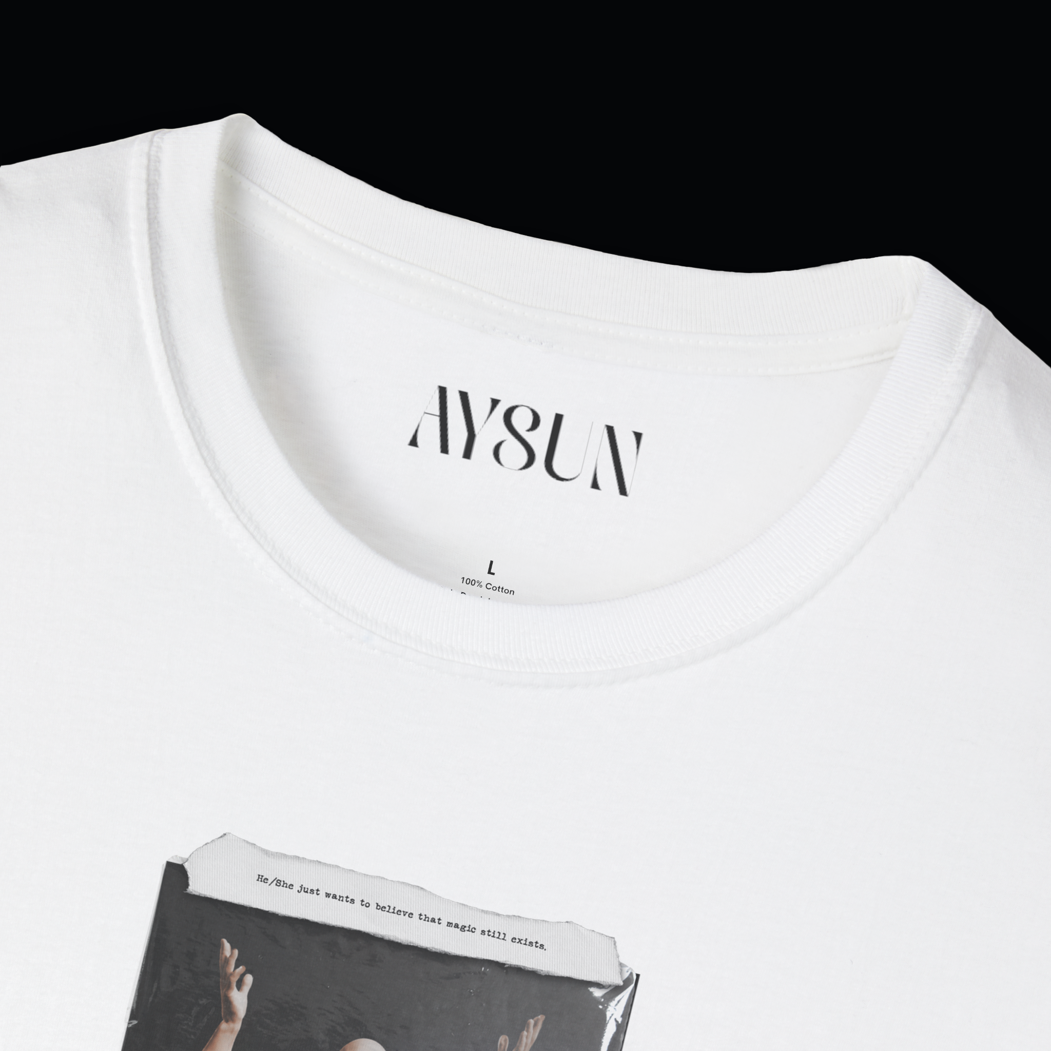 Person wearing a black t-shirt with a graphic design and blue jeans on a white background