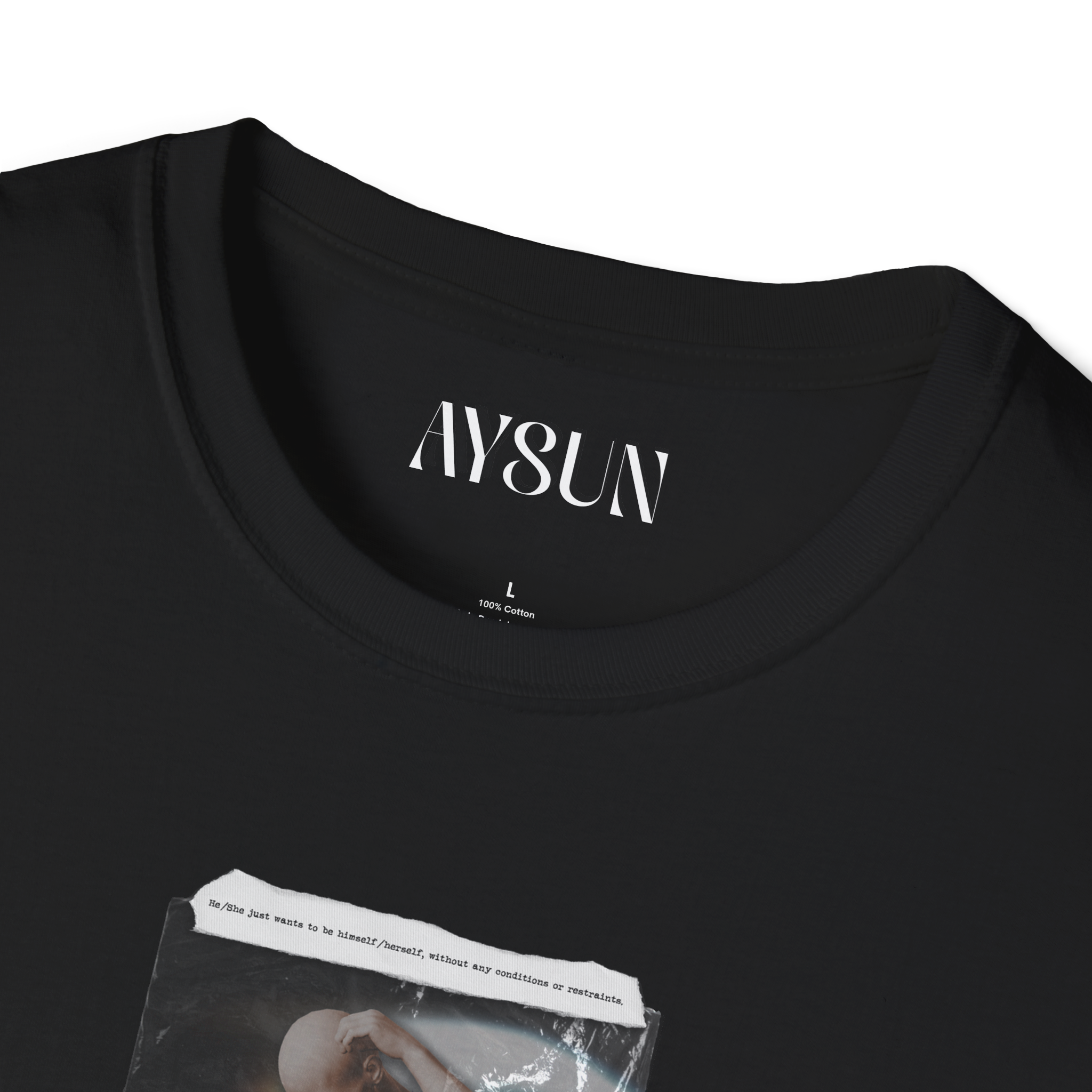 Man wearing a black t-shirt with a graphic design on a gray background