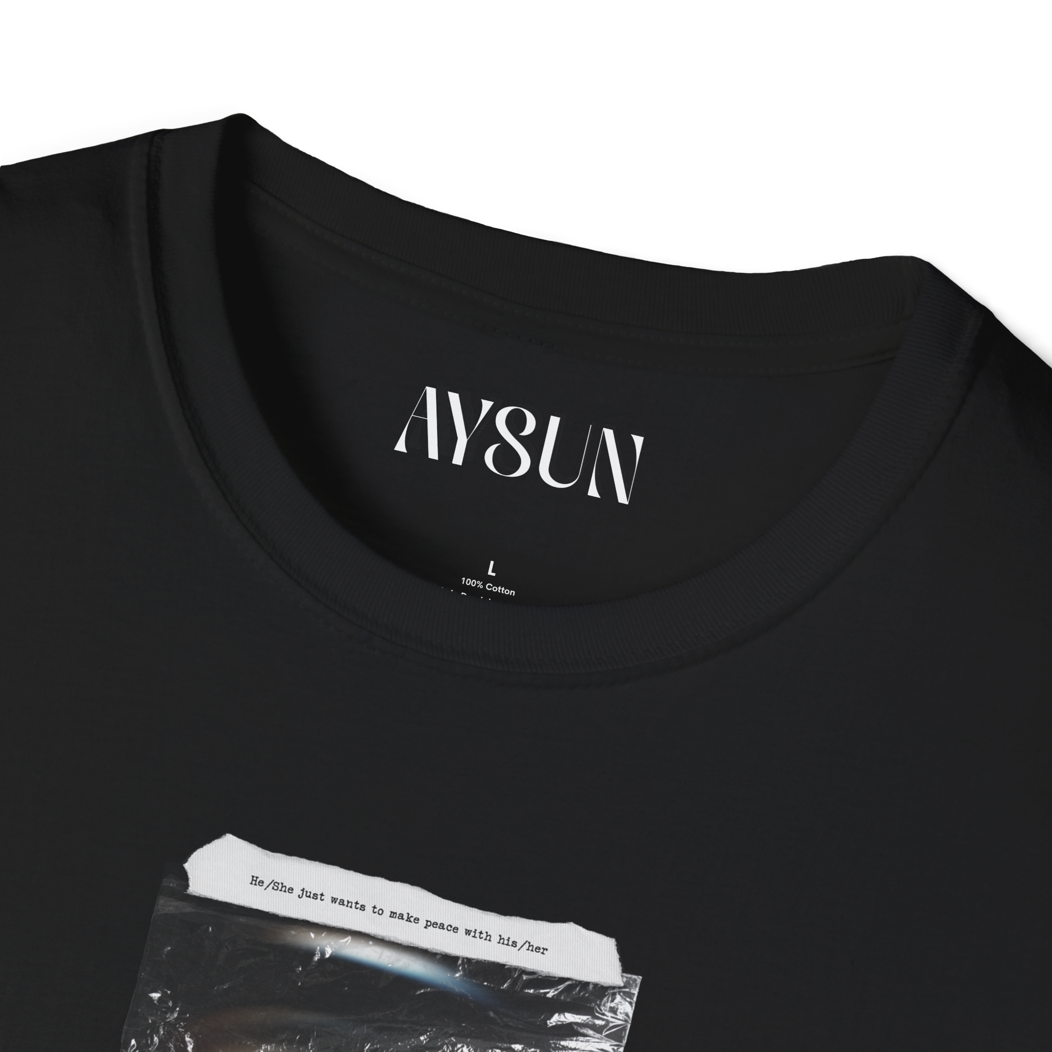 Woman wearing a black t-shirt with a graphic design on a plain background