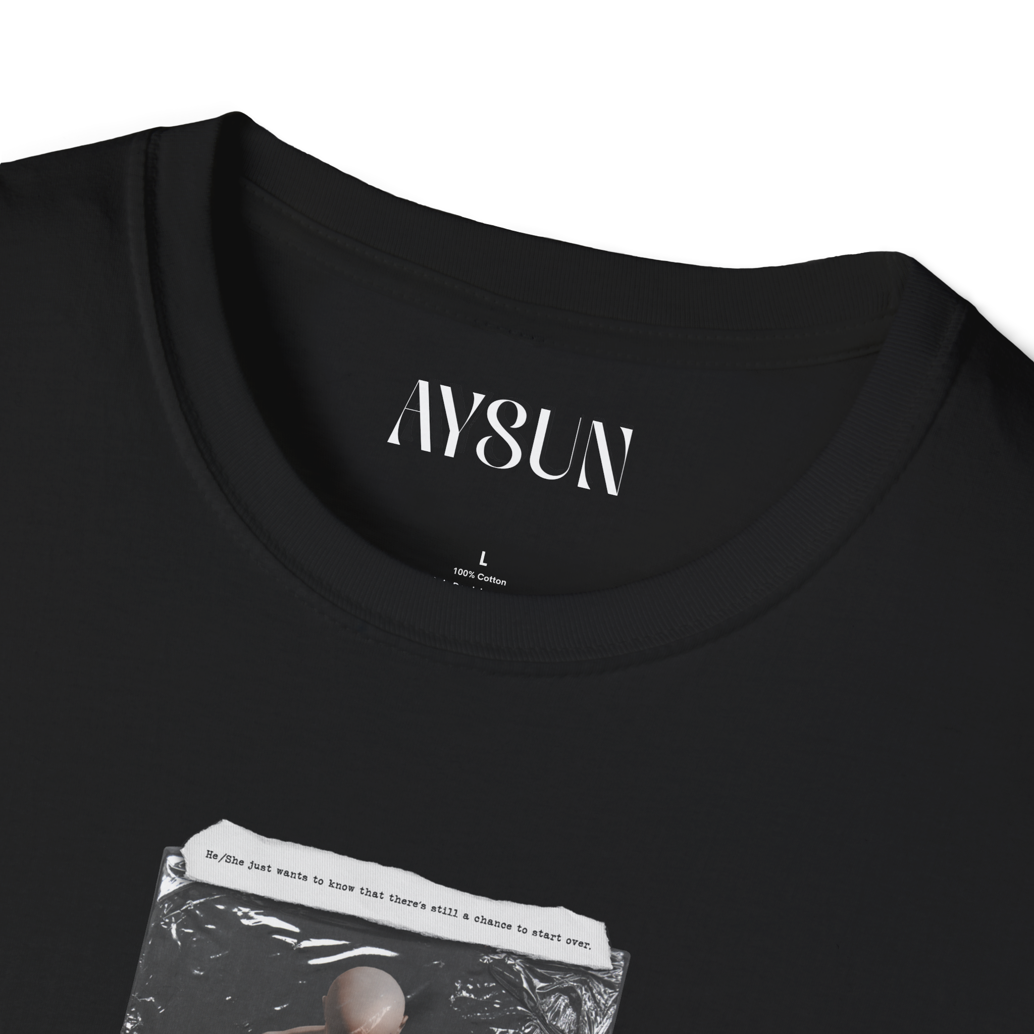 Person wearing a black t-shirt with a graphic design on a plain background