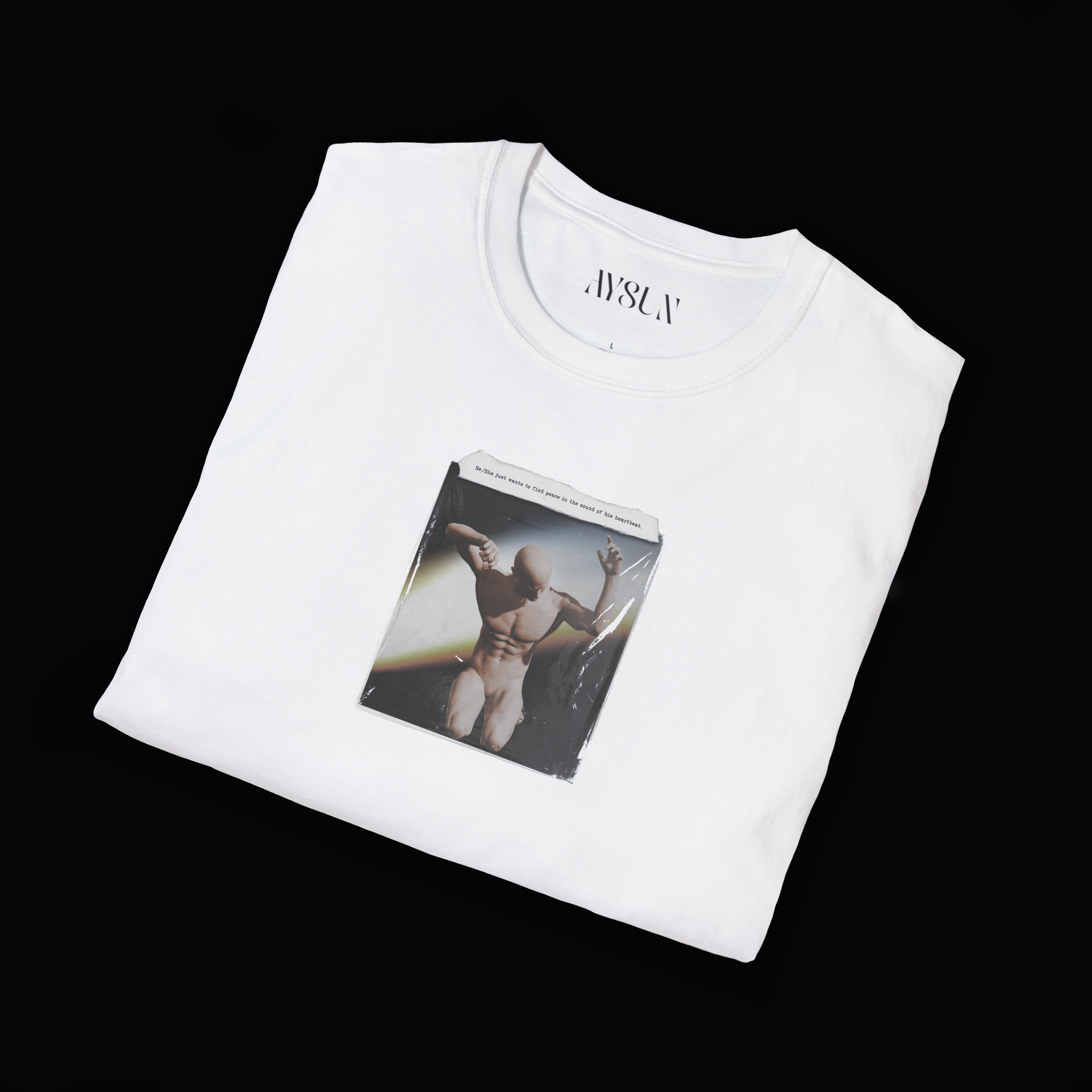 Man wearing a black t-shirt with a graphic design on a plain background