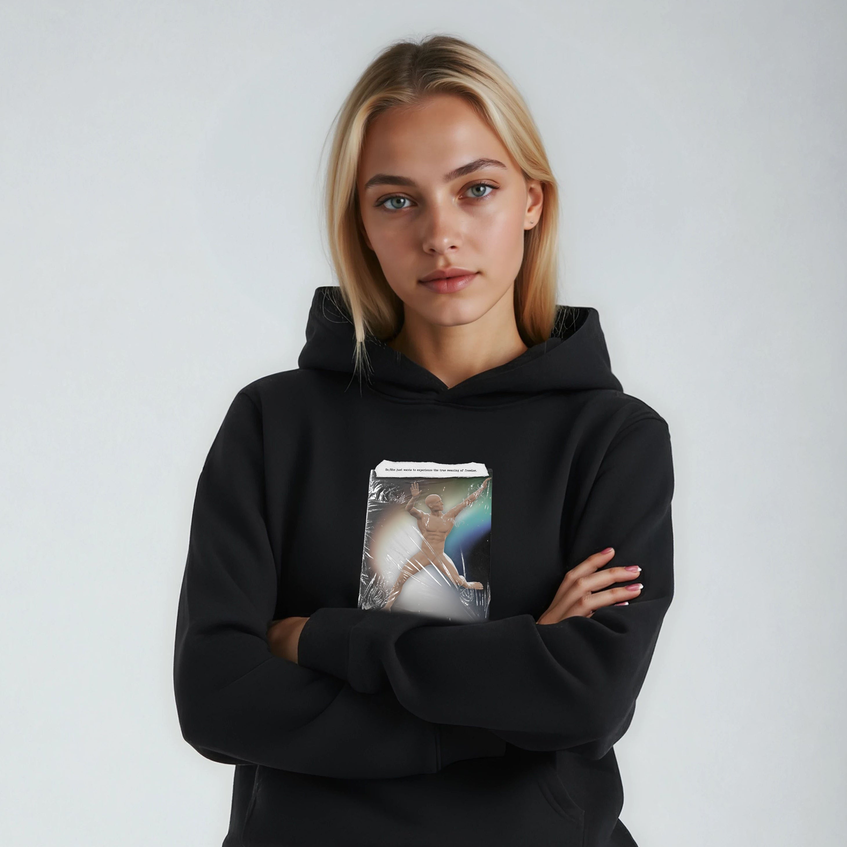 Person wearing a black hoodie with a graphic design on a plain background