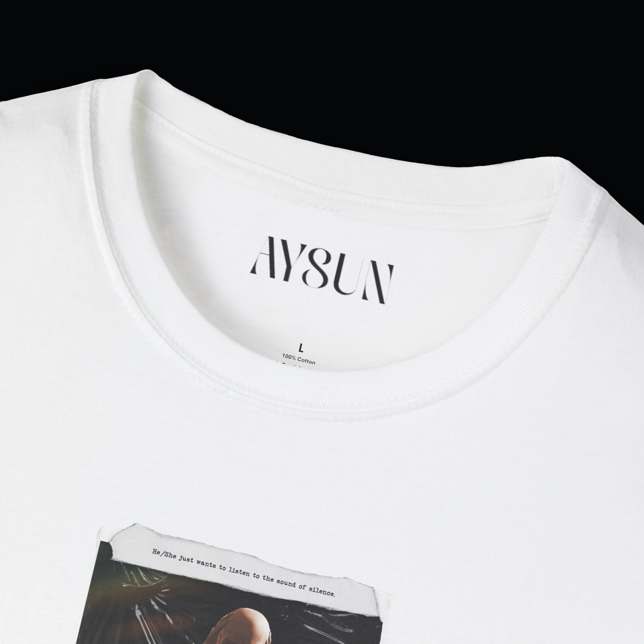 Person wearing a black t-shirt with a graphic design on a plain background