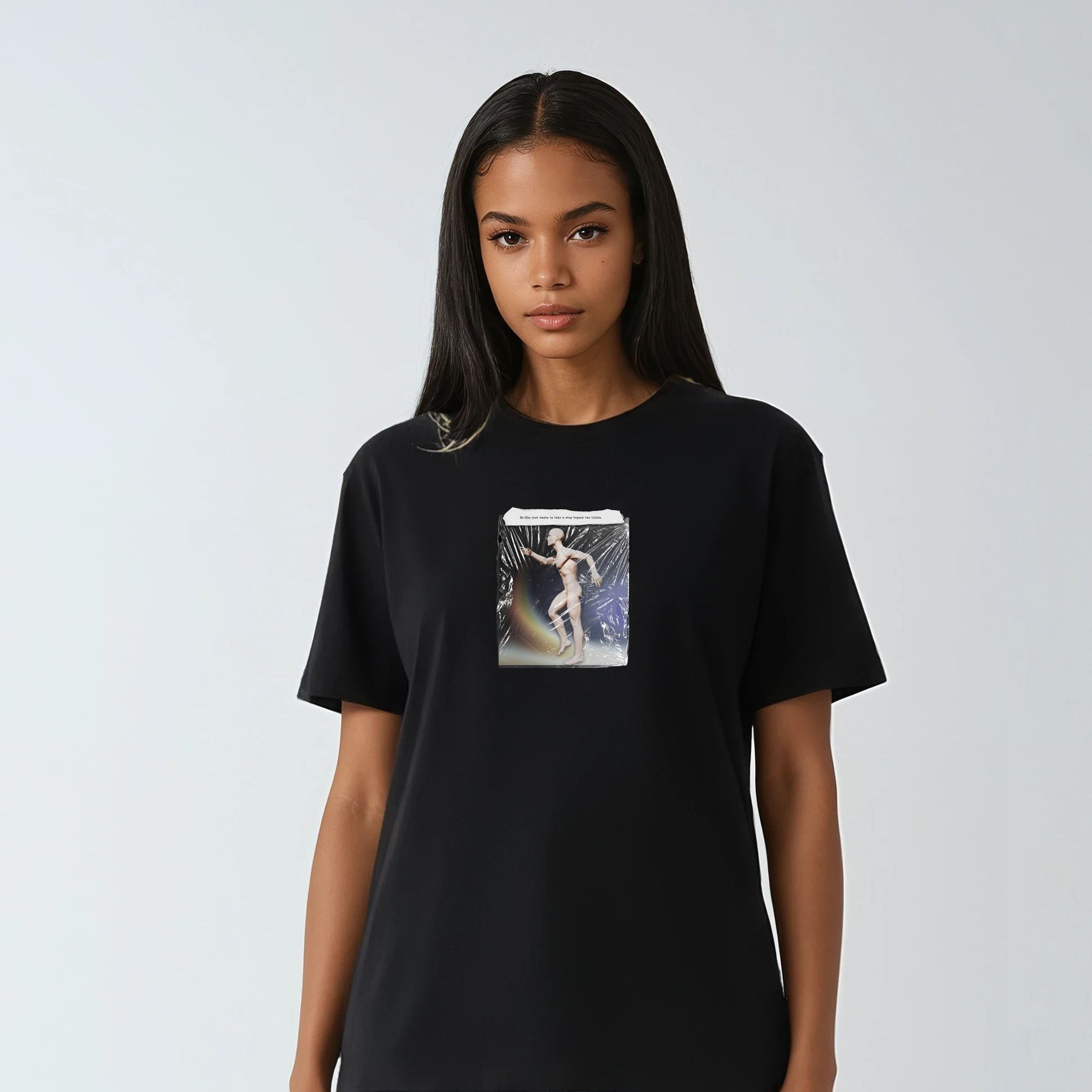 Person wearing a black t-shirt with a graphic design on a white background