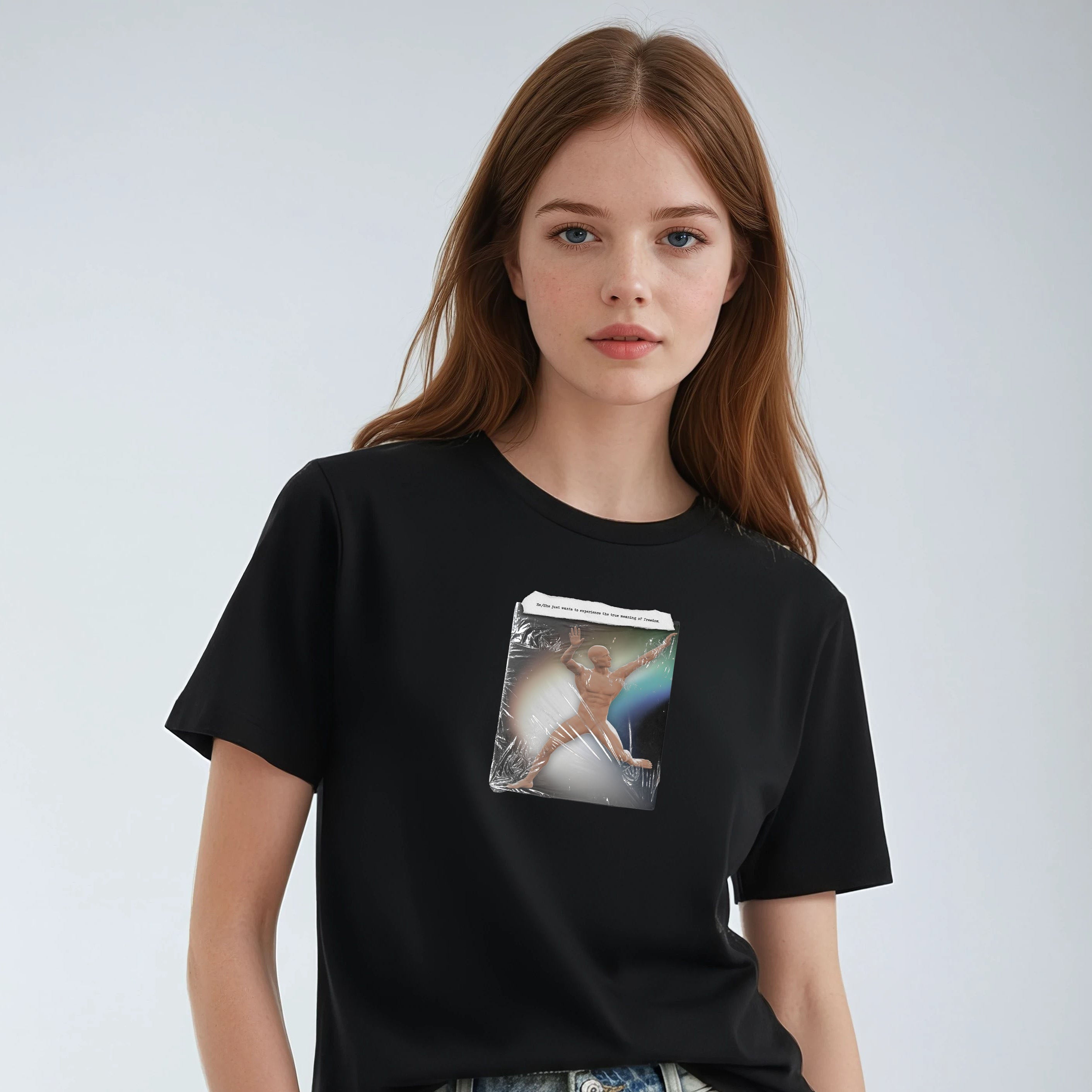 Person wearing a black t-shirt with a graphic design on a plain background